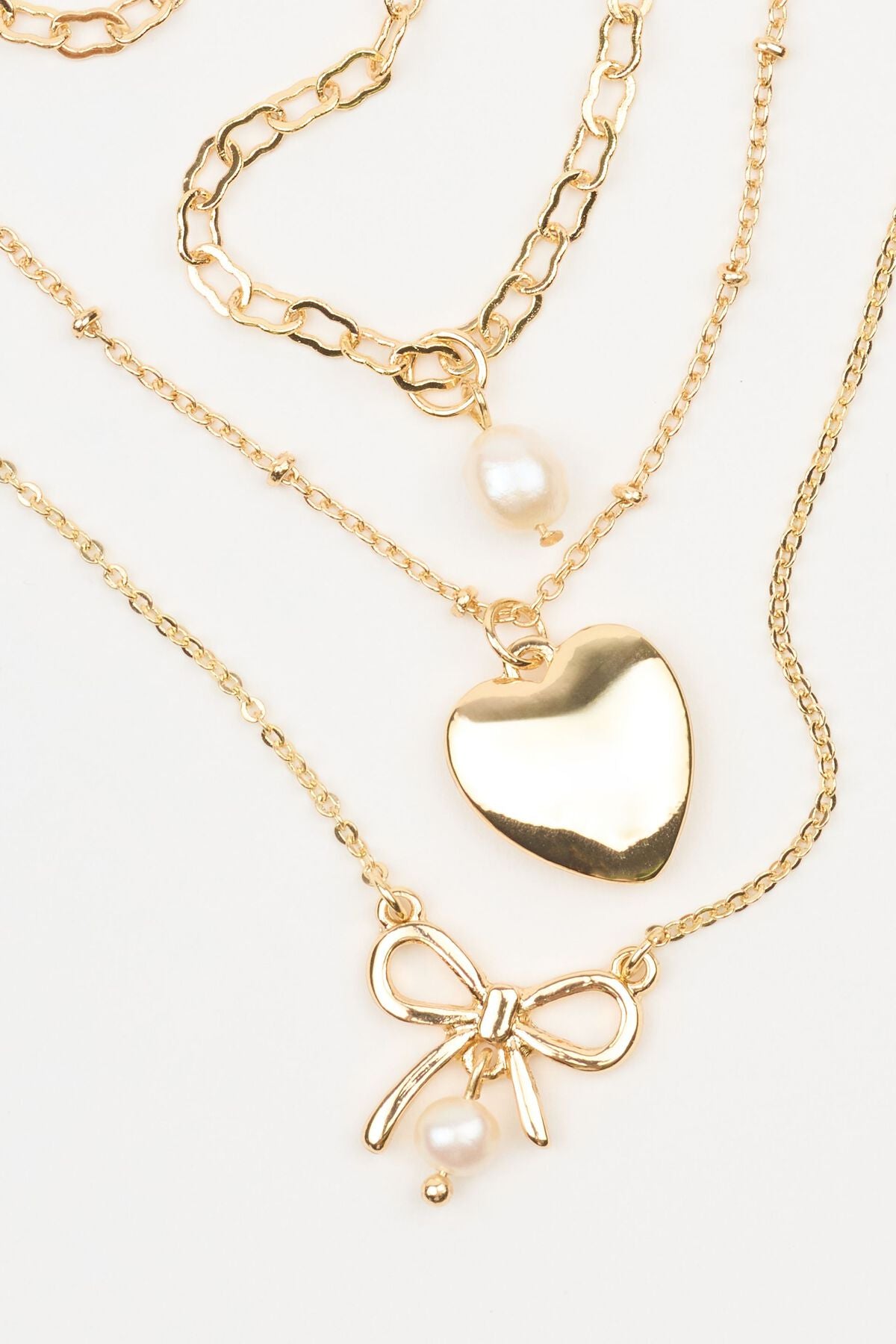 Set of 3 Bow, Pearl, and Heart Necklaces White Garage Clothing Women